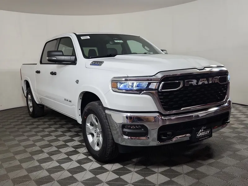 2026 RAM 1500 RAM 1500 BIG HORN CREW CAB 4X4 5'7' BOX in Bright White Clear-Coat Exterior Paint — front three-quarter view