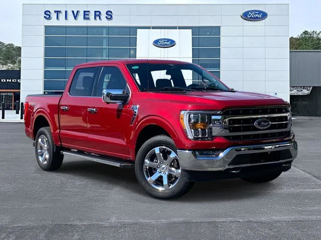2023 Ford F-150 Lariat in Rapid Red Metallic Tinted Clearcoat — front three-quarter view