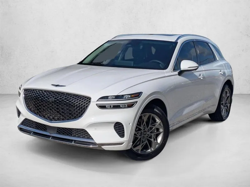 2023 Genesis GV70 2.5T AWD in Alta White — front three-quarter view