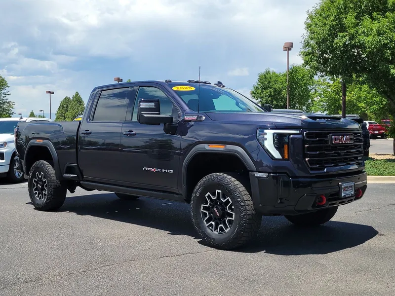 2025 GMC Sierra 2500HD AT4X in Titanium Rush Metallic — front three-quarter view
