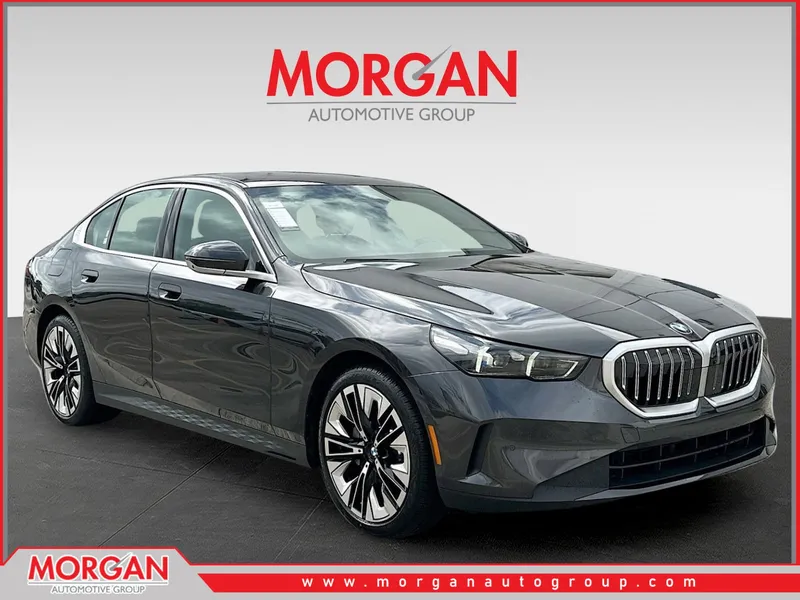 2026 BMW 5 Series 530i in Dark Graphite — front three-quarter view