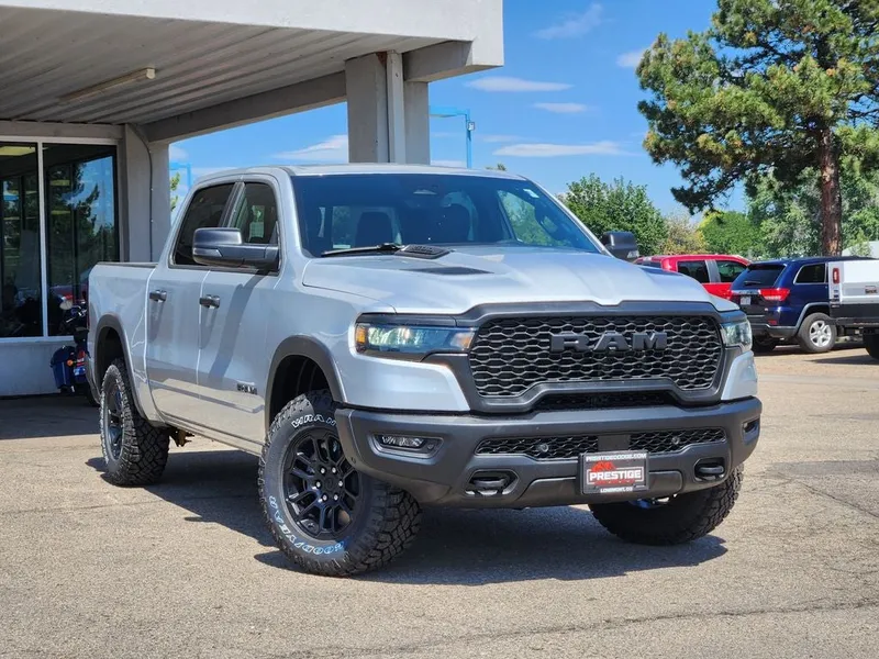 2026 RAM 1500 RAM 1500 REBEL CREW CAB 4X4 5'7' BOX in Silver Zynith Exterior Paint — front three-quarter view