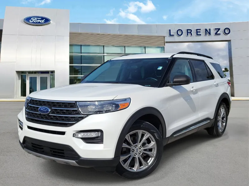 2023 Ford Explorer XLT in Star White Metallic Tri-Coat — front three-quarter view