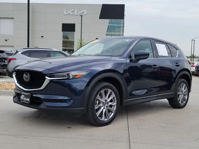 2019 Mazda Mazda CX-5 Grand Touring in Deep Crystal Blue Mica — front three-quarter view