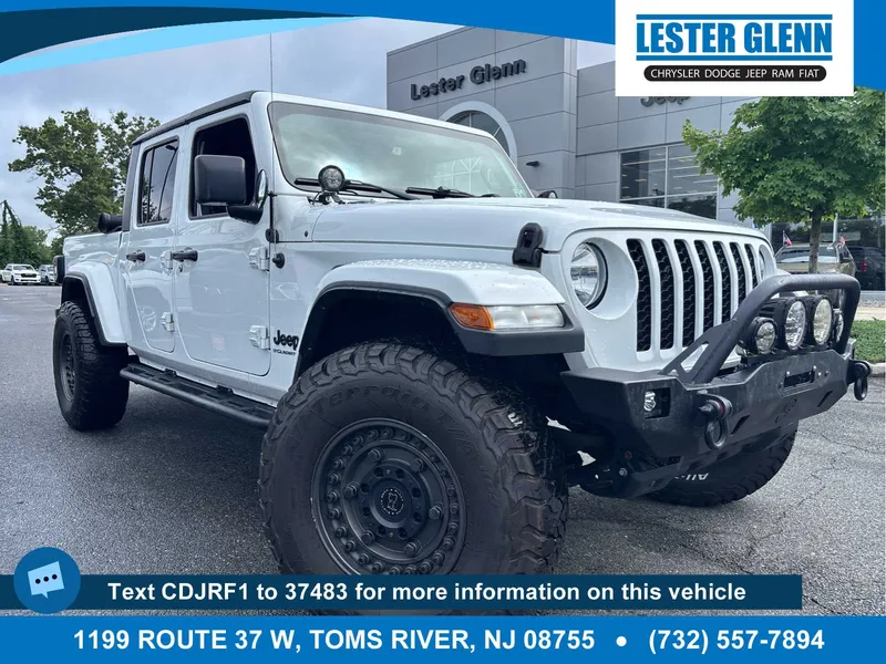 2023 Jeep Gladiator Sport S in Bright White Clear Coat — front three-quarter view