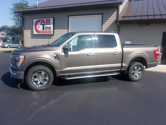 2022 Ford F-150 LARIAT in Stone Gray Metallic — front three-quarter view