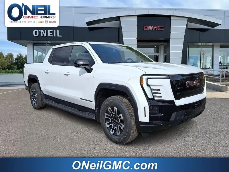 2026 GMC Sierra EV Elevation Standard Range in Summit White — front three-quarter view