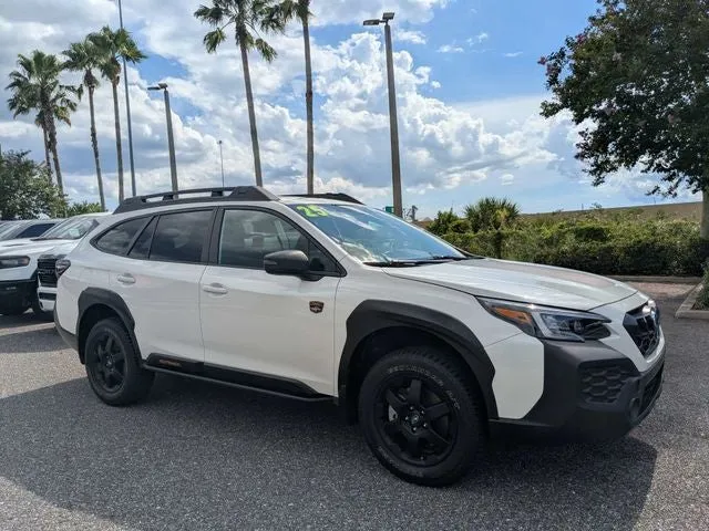 2025 Subaru Outback Wilderness in Crystal White Pearl — front three-quarter view