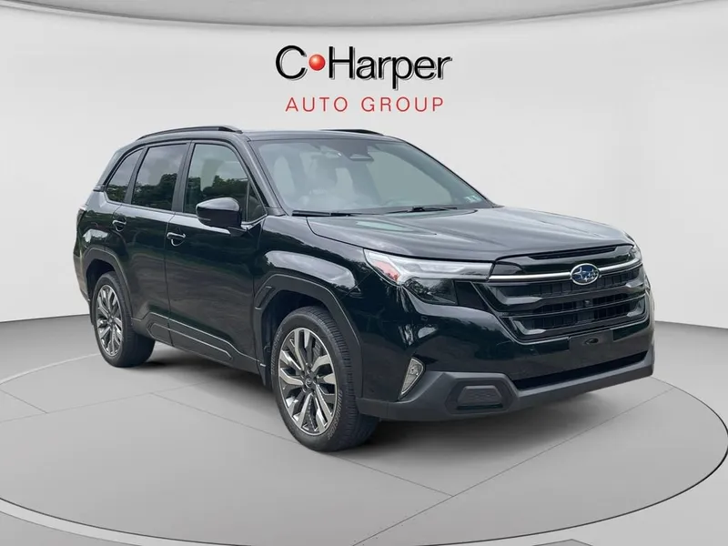 2025 Subaru Forester Touring in Black — front three-quarter view