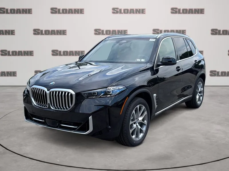 2026 BMW X5 xDrive40i in Black Sapphire Metallic — front three-quarter view