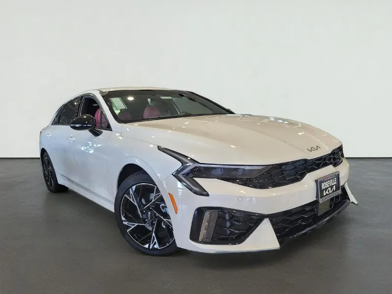 2026 Kia K5 GT-LINE in Snow White Pearl — front three-quarter view