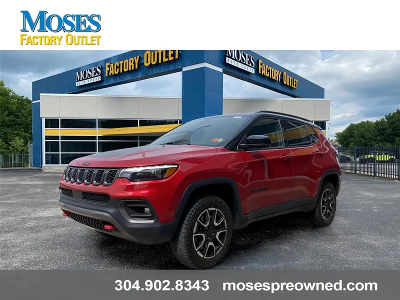 2025 Jeep Compass Trailhawk in Red Hot Pearlcoat — front three-quarter view