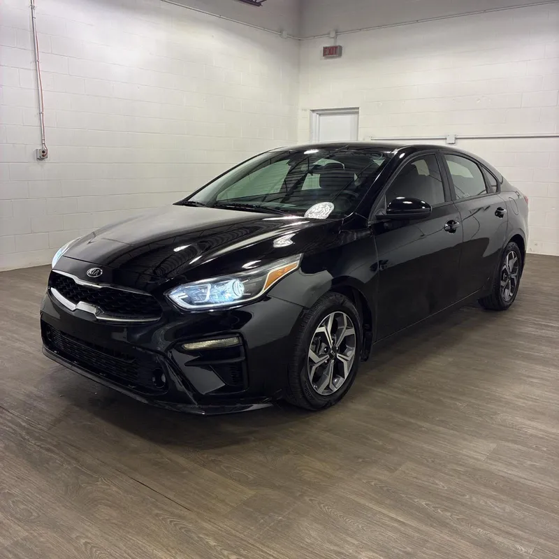 2021 Kia Forte LXS in Aurora Black — front three-quarter view