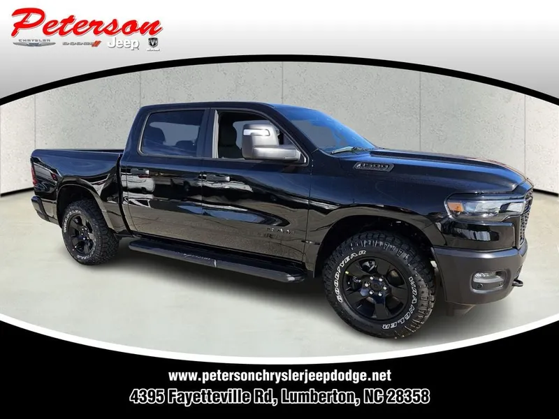 2026 RAM Ram 1500 RAM 1500 WARLOCK CREW CAB 4X4 5'7' BOX in Diamond Black Crystal Pearl-Coat Exterior Paint — front three-quarter view