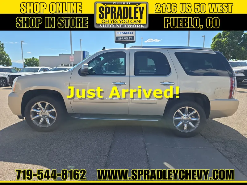 2012 GMC Yukon Denali in Gold Mist Metallic — front three-quarter view