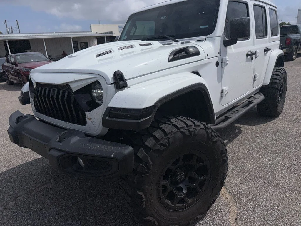 2024 Jeep Wrangler Sahara in White — front three-quarter view