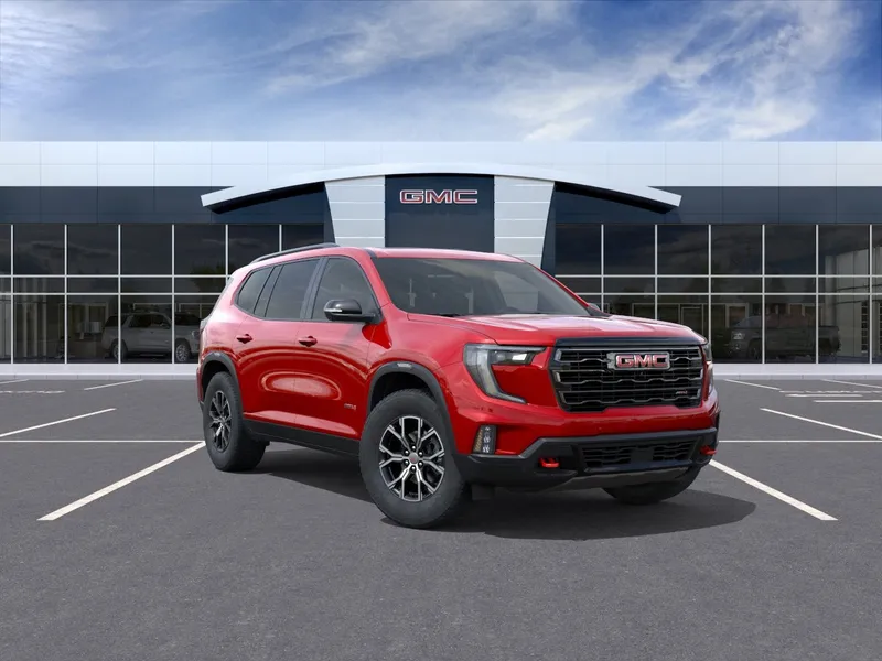 2026 GMC Acadia AT4 in Volcanic Red Tintcoat — front three-quarter view