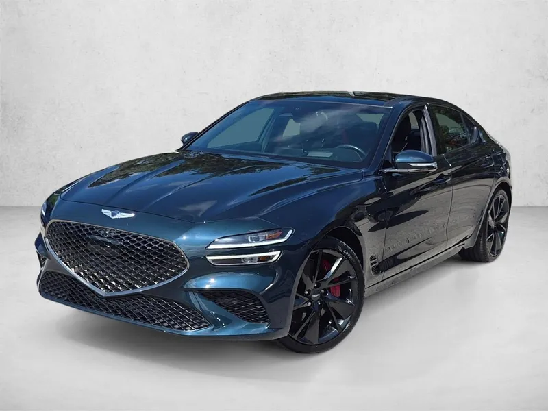 2023 Genesis G70 3.3T RWD in Tasman Blue — front three-quarter view