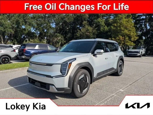 2026 Kia EV9 Wind in Ivory Silver — front three-quarter view