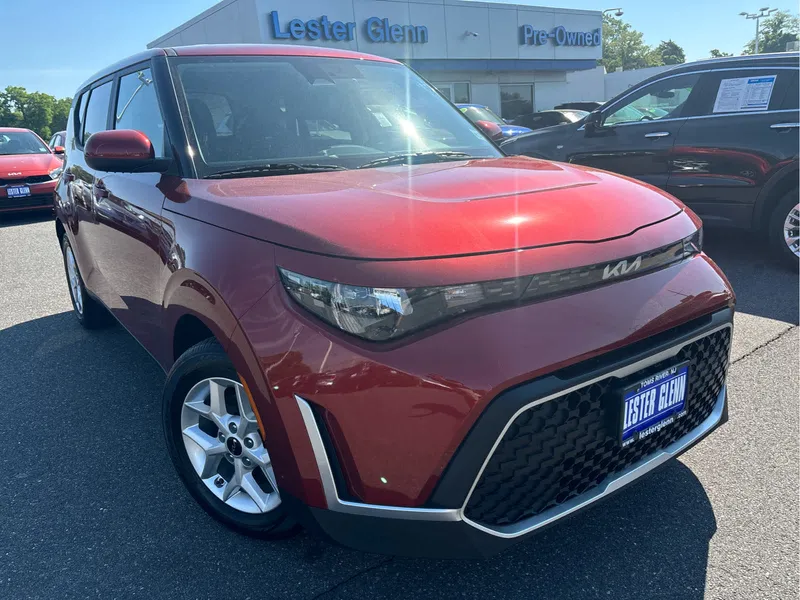 2023 Kia Soul LX in Mars Orange — front three-quarter view