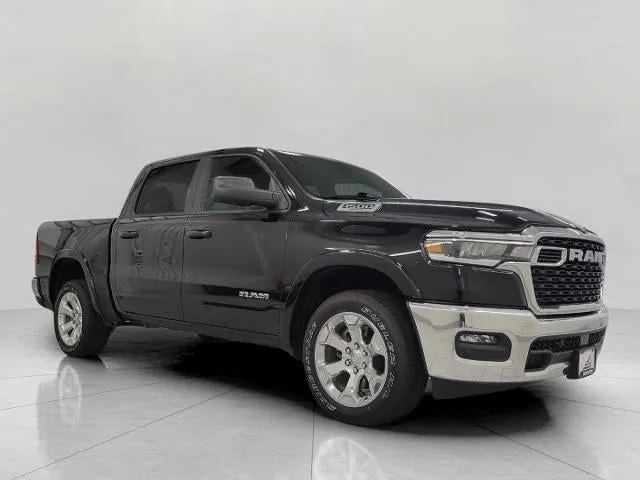 2025 RAM 1500 Big Horn Crew Cab 4x4 5'7" Box in Diamond Black Crystal Pearlcoat — front three-quarter view