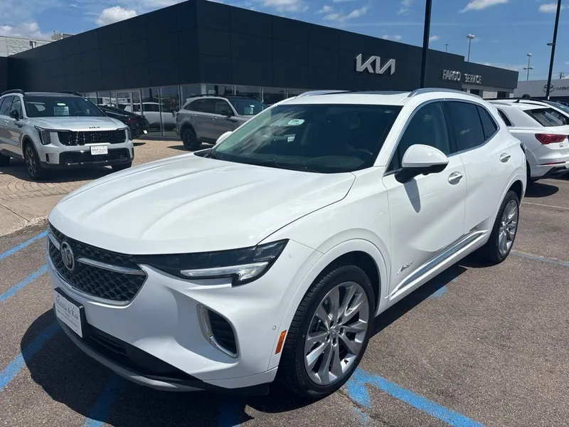 2022 Buick Envision Avenir in Summit White — front three-quarter view