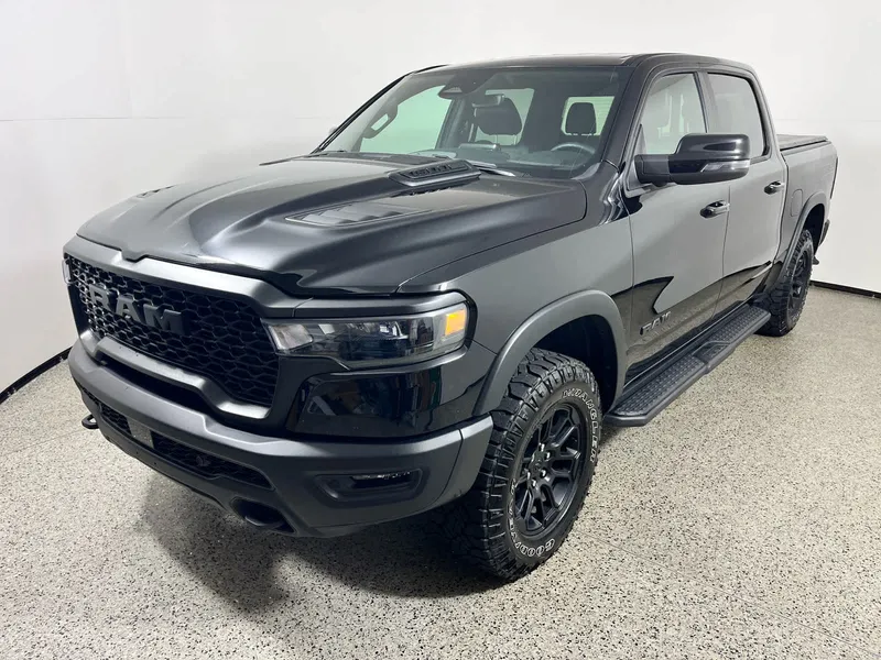 2025 RAM 1500 Rebel in Diamond Black Crystal Pearlcoat — front three-quarter view