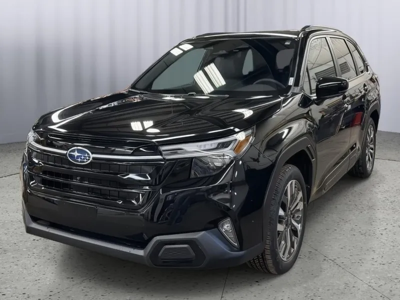 2026 Subaru FORESTER Touring in Crystal Black Silica — front three-quarter view