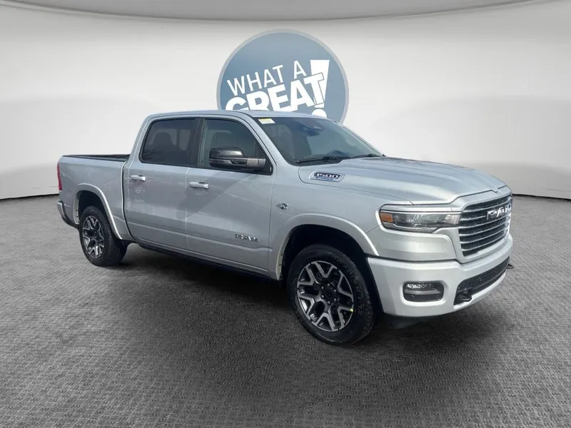 2026 RAM 1500 Laramie in Silver Zynith — front three-quarter view