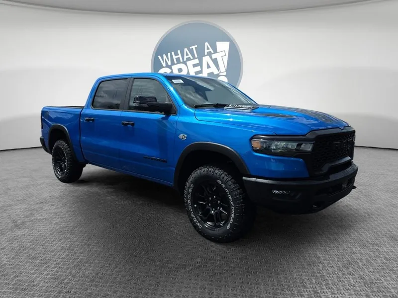 2026 RAM 1500 Rebel in Hydro Blue Pearlcoat — front three-quarter view