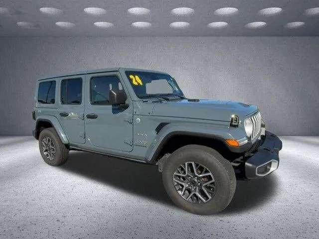 2024 Jeep Wrangler Sahara in Anvil — front three-quarter view