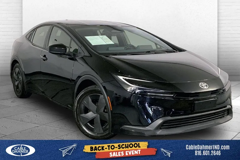 2025 Toyota Prius LE in Midnight Black Me — front three-quarter view