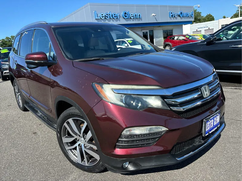 2016 Honda Pilot Touring in Dark Cherry Pearl — front three-quarter view