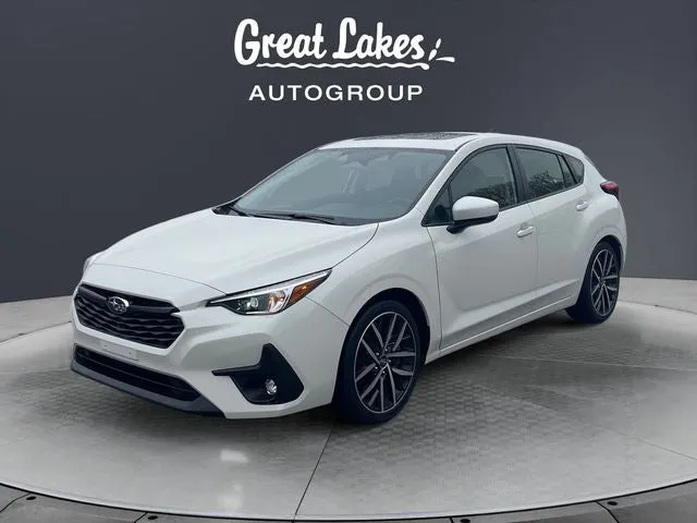 2024 Subaru Impreza Sport in Crystal White Pearl — front three-quarter view