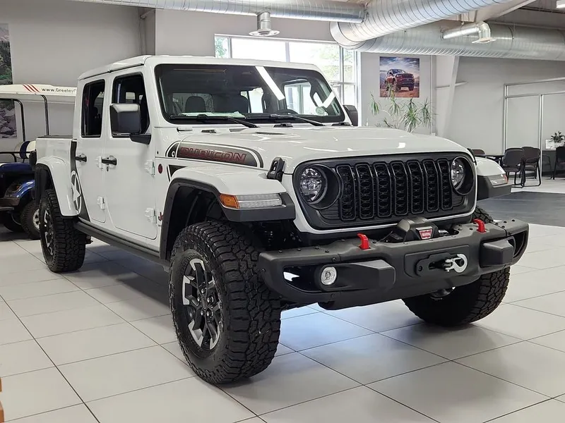 2026 Jeep Gladiator GLADIATOR SHADOW OPS 4X4 in Bright White Clear-Coat Exterior Paint — front three-quarter view