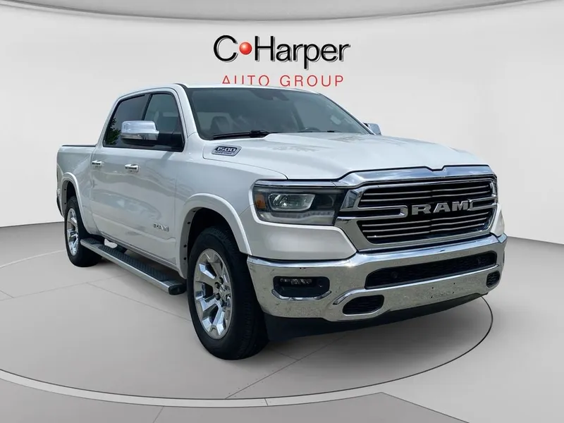 2021 RAM 1500 Laramie in Ivory White Tri-Coat Pearlcoat — front three-quarter view