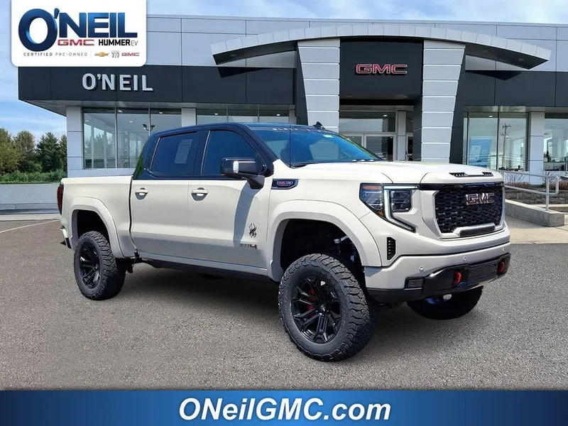 2026 GMC Sierra 1500 AT4 in Coastal Dune — front three-quarter view