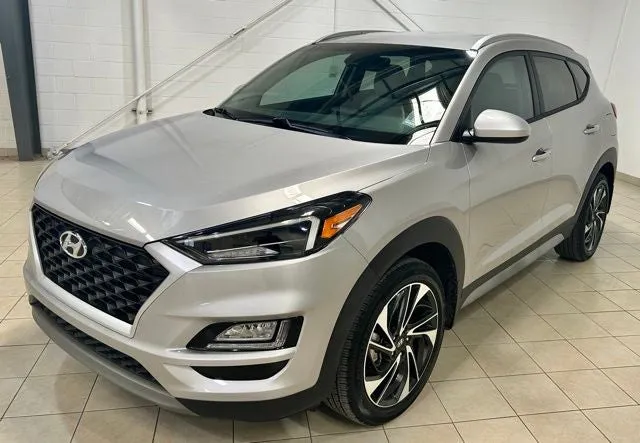 2021 Hyundai Tucson Sport in Stellar Silver — front three-quarter view
