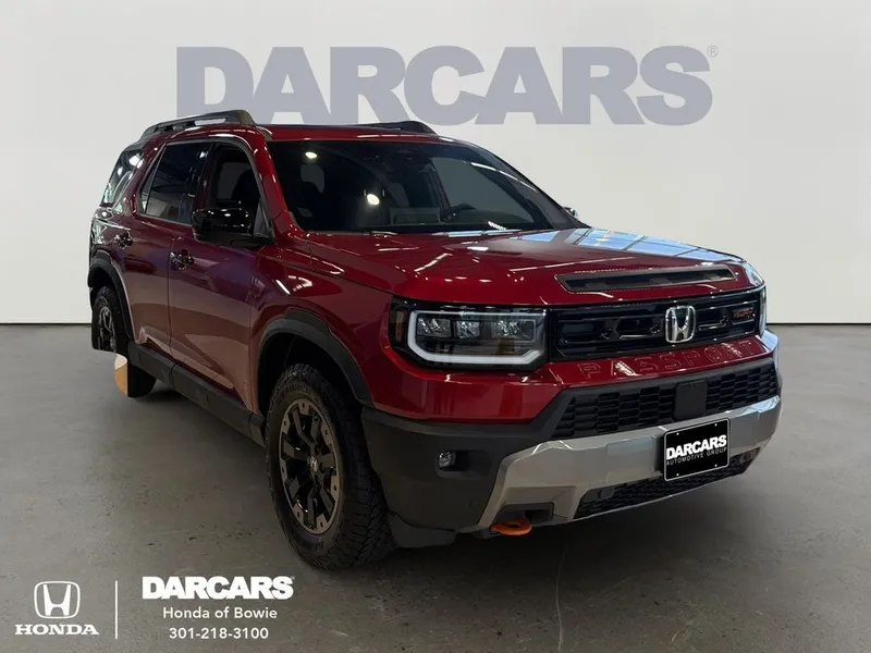 2026 Honda Passport Base in Radiant Red — front three-quarter view
