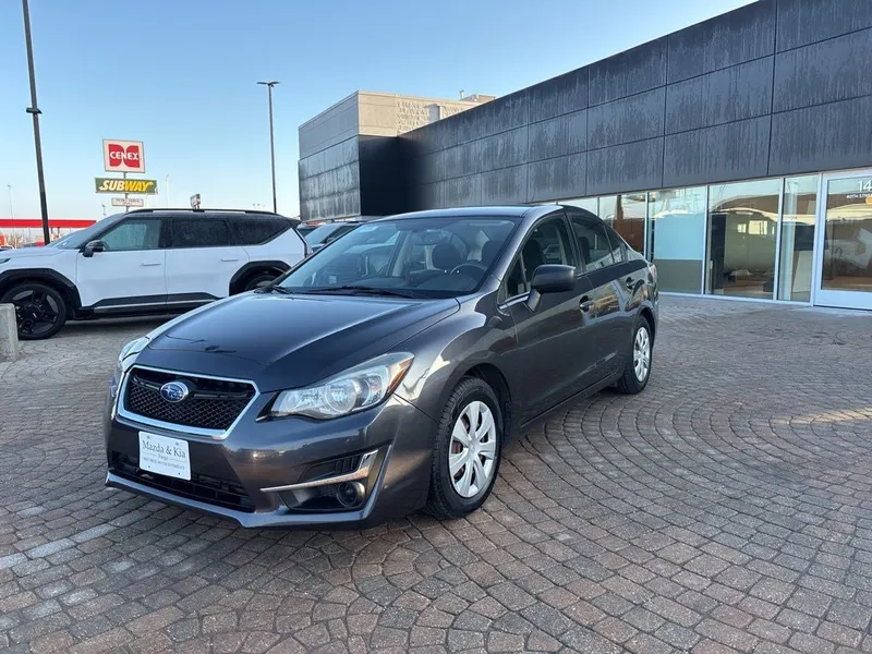 2015 Subaru Impreza 2.0i in Dark Gray Metallic — front three-quarter view