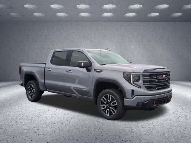 2025 GMC Sierra 1500 AT4 in Sterling Metallic — front three-quarter view