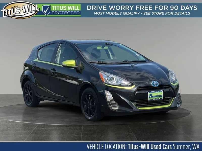 2016 Toyota Prius c Persona Series in Black Sand Pearl — front three-quarter view