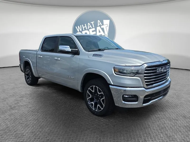 2026 RAM 1500 Laramie in Silver Zynith — front three-quarter view