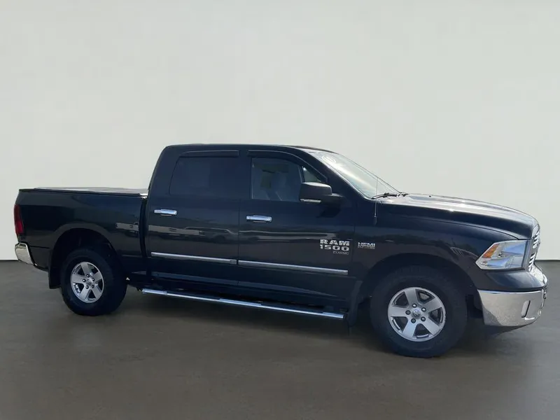 2019 RAM 1500 Classic SLT in Brilliant Black Crystal Pearlcoat — front three-quarter view