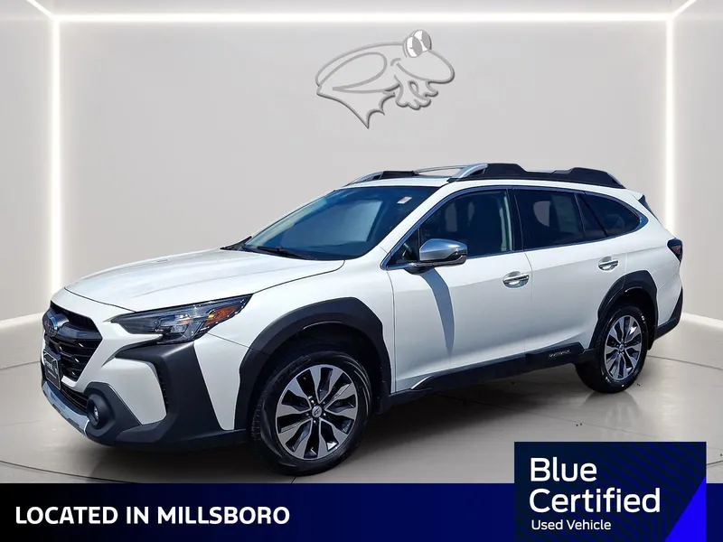 2023 Subaru Outback Touring in Crystal White Pearl — front three-quarter view