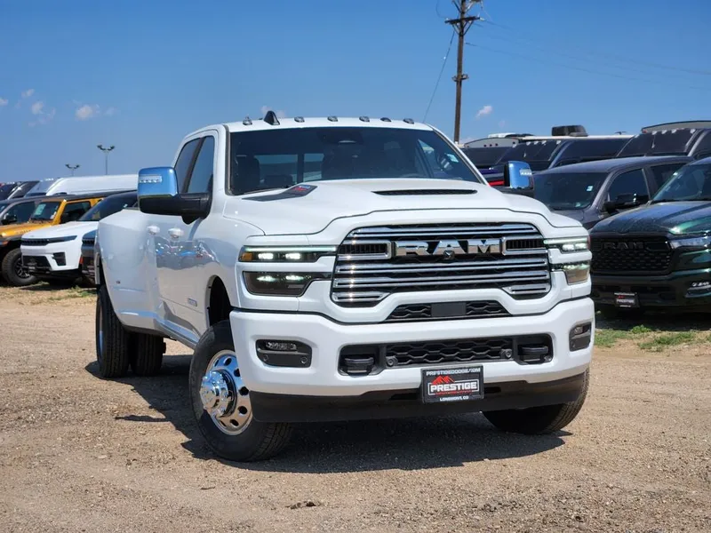 2026 RAM 3500 RAM 3500 LARAMIE CREW CAB 4X4 8' BOX in Bright White Clear-Coat Exterior Paint — front three-quarter view