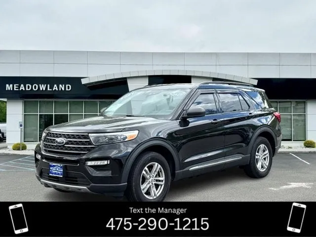 2021 Ford Explorer XLT in Agate Black Metallic — front three-quarter view