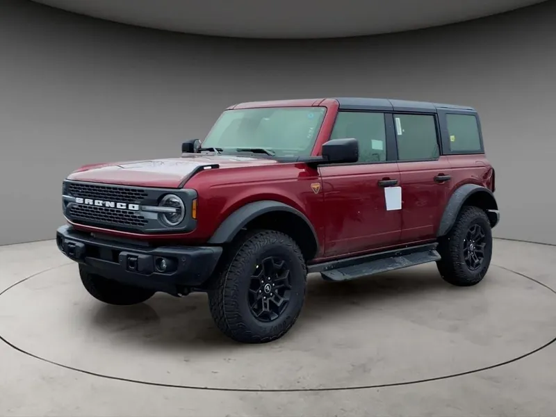 2026 Ford Bronco Badlands in Ruby Red Metallic — front three-quarter view