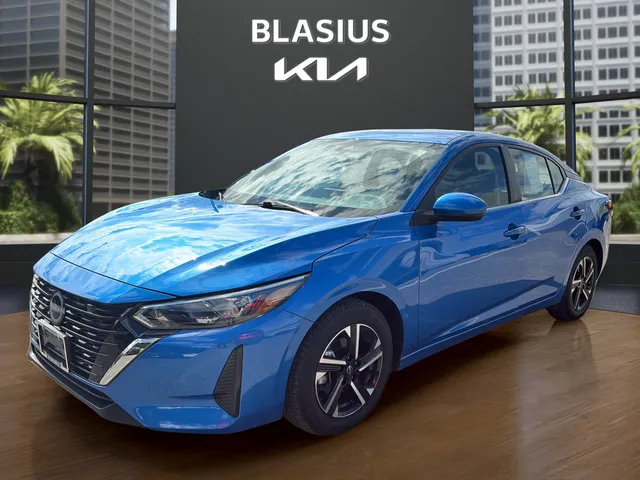 2024 Nissan Sentra SV in Electric Blue Metallic — front three-quarter view
