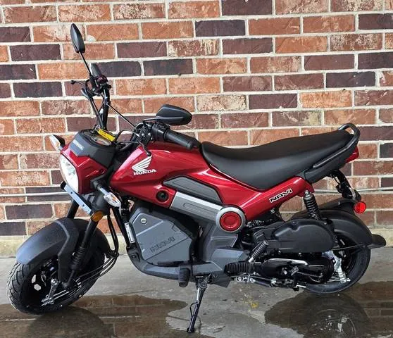 2026 Honda® Navi Pearl Red — front three-quarter view